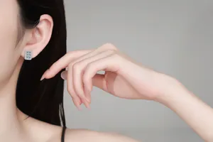 Model wearing S925 sterling silver square moissanite earrings with pavé set zircon