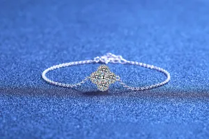 Detailed close-up of 925 sterling silver clover bracelet with white moissanite