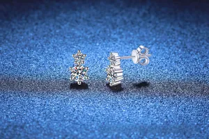 Macro shot of 925 sterling silver stud earrings with double-layered moissanite stones
