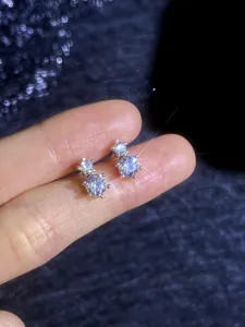 Detail of 925 sterling silver earrings featuring two brilliant-cut moissanite stones