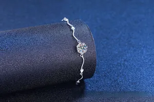 Macro detail of S925 sterling silver heart bracelet with sparkling moissanite stone
