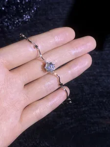 Detailed shot of an S925 silver moissanite bracelet with heart links on a wrist