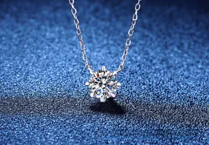 Macro view of 1ct moissanite solitaire pendant with six-prong setting on S925 silver chain