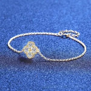 925 sterling silver clover bracelet with sparkling moissanite stones on a blue background