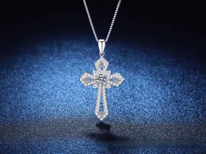 Close-up of S925 sterling silver cross pendant featuring sparkling moissanite stones
