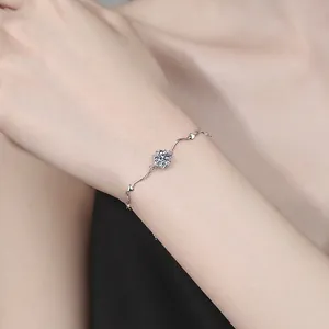 Elegant S925 sterling silver heart bracelet with a 1ct round moissanite on model's wrist