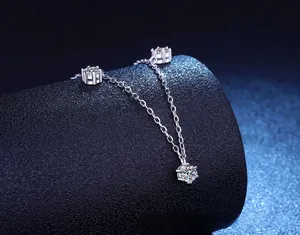 Detailed macro view of S925 silver necklace with three six-prong moissanite pendants