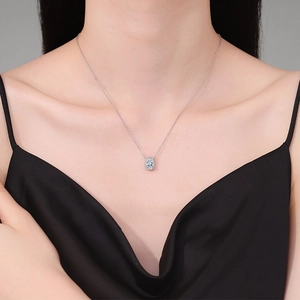 Elegant S925 sterling silver necklace with pear-shaped halo pendant on model