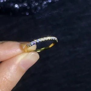 Elegant gold plated S925 sterling silver moissanite row ring shown on model hand
