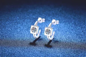 Detailed close-up of geometric square S925 sterling silver moissanite stud earrings