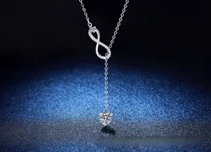 Macro detail of S925 silver infinity pendant with sparkling moissanite stone