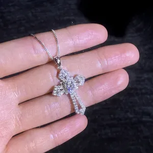 S925 sterling silver cross pendant necklace with moissanite, hand-held close-up shot