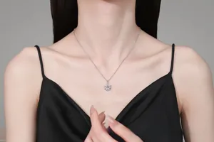 Close-up of snowflake pendant necklace with cubic zirconia on a silk background