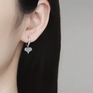 S925 sterling silver heart earrings with white cubic zirconia pavé on model