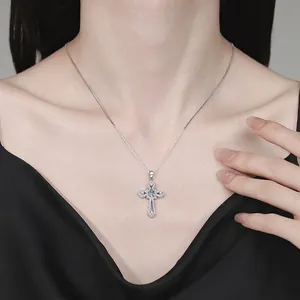 Elegant S925 sterling silver cross pendant necklace with sparkling moissanite on a model