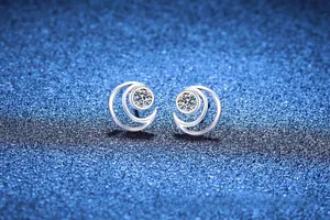 Detailed macro view of S925 sterling silver moon star earrings with D-color moissanite stones
