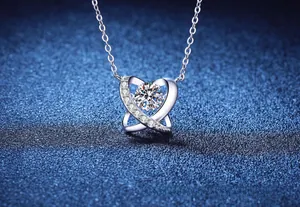 Macro shot of S925 silver double heart pendant with sparkling round moissanite center