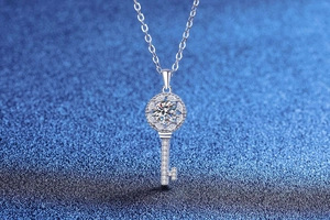 Macro shot of S925 sterling silver key necklace with brilliant moissanite stone