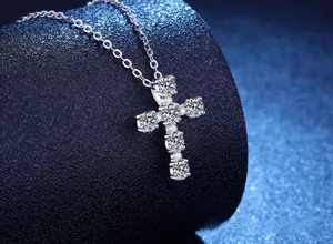 Close-up of S925 sterling silver cross necklace with sparkling moissanite stones