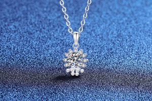 Detail of S925 silver petal pendant with moissanite and three elegant pearls