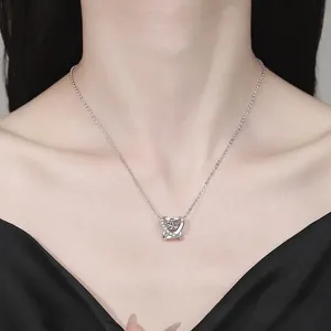Elegant S925 sterling silver moissanite heart pendant necklace on a female model