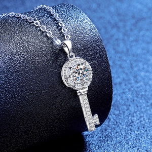 S925 sterling silver key necklace featuring a large moissanite center stone and halo