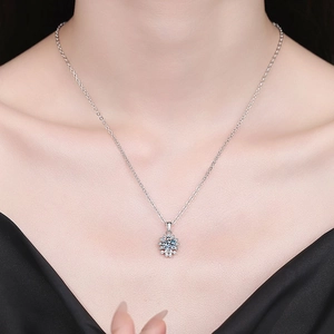 Elegant s925 silver necklace with snowflake pendant featuring a blue moissanite stone