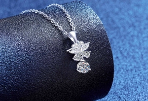 Macro shot of S925 silver butterfly necklace pendant with marquise moissanite stones