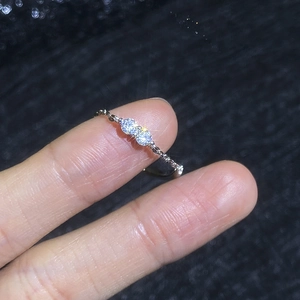 Minimalist silver chain ring featuring two sparkling round-cut moissanite stones