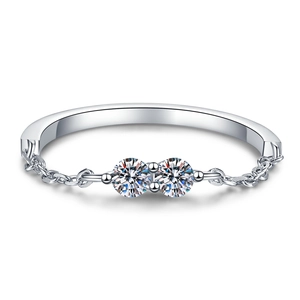 Fashionable silver moissanite bracelet with two stones on a sleek metal chain for women