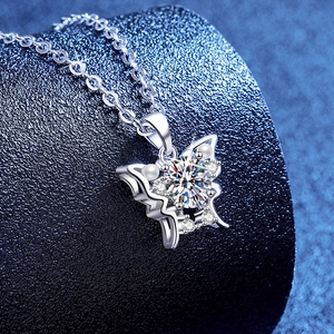 925 silver butterfly necklace with moissanite and pearls on dark display stand