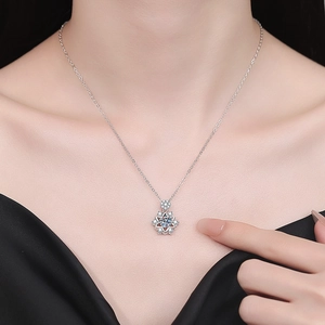 Elegant 1 carat moissanite snowflake necklace in silver on model for Christmas gift
