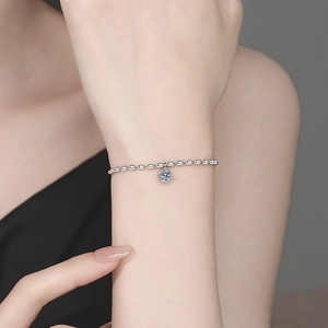 Elegant S925 sterling silver bracelet with oval beads and a sparkling round moissanite pendant