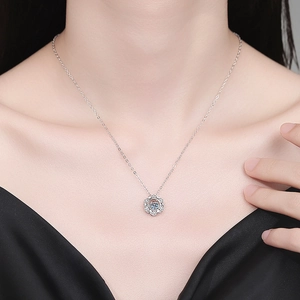 Elegant S925 sterling silver snowflake necklace with 0.5ct moissanite on a female model