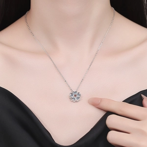 S925 sterling silver four-leaf clover heart necklace with sparkling blue crystals on a model