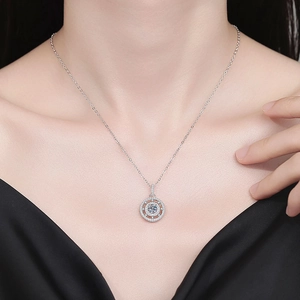 Sparkling Moissanite compass pendant necklace in S925 sterling silver worn by a model
