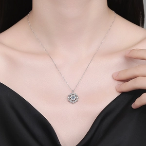 Elegant S925 sterling silver snowflake spinning necklace with moissanite on model