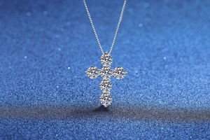 Close-up of S925 sterling silver cross pendant with six brilliant moissanite stones