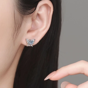 Elegant S925 sterling silver butterfly earrings with moissanite stones on female ear