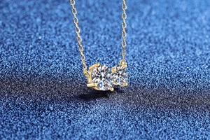 Close-up of S925 silver double stone moissanite necklace with round cut gems