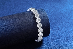 Macro view of S925 sterling silver sunflower bracelet with micro-pave moissanite stones
