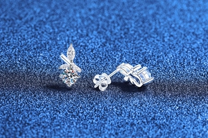Macro view of S925 sterling silver bamboo leaf stud earrings with round moissanite stones