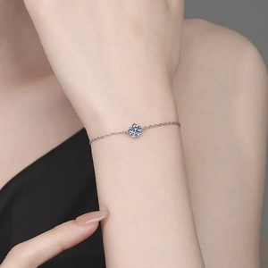 Minimalist four-prong adjustable tennis bracelet with round brilliant moissanite stone