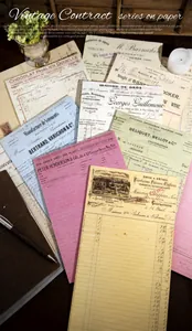 Detail of vintage contract series paper pad with fountain pen and retro props setup