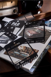 Macro detail of retro collage frame stickers with vintage film and luggage tag designs
