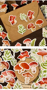 Detail of vintage watercolor mushroom and forest fern stickers on kraft paper and wood