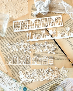 Strisce di carta pizzo bianco tagliate al laser con motivi floreali e vintage