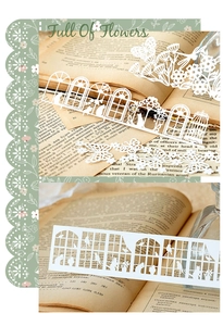 Dettaglio di carta pizzo retrò con ritagli di fiori e farfalle per scrapbooking