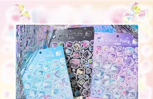 Close-up of Winter Fairy laser stickers with dreamy butterflies and sparkling ice patterns