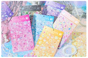 Close-up of Winter Fairy series scrapbooking stickers with frozen ice and star motifs